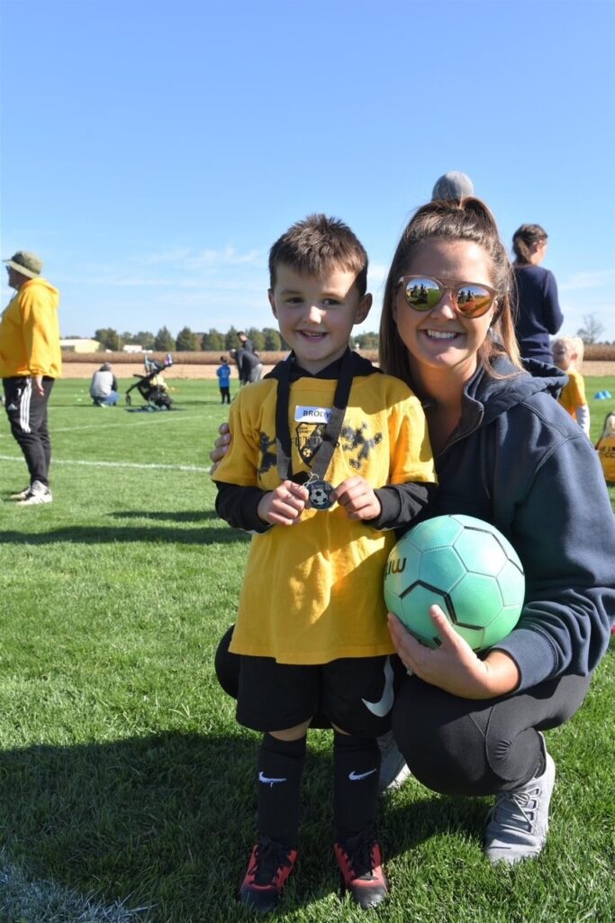 brittany and son with a soccer ball