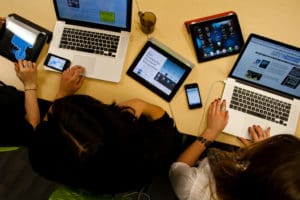 a top view of people using laptops