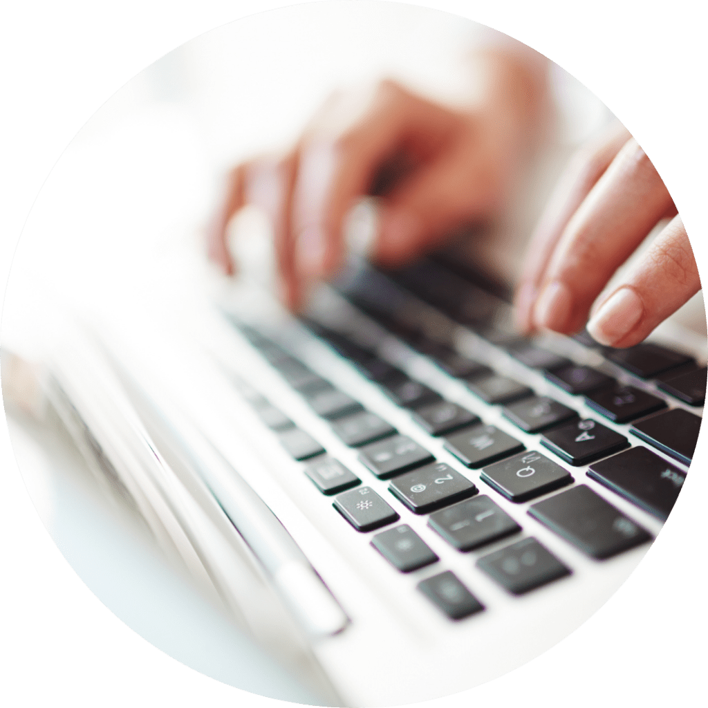 hands typing on keyboard